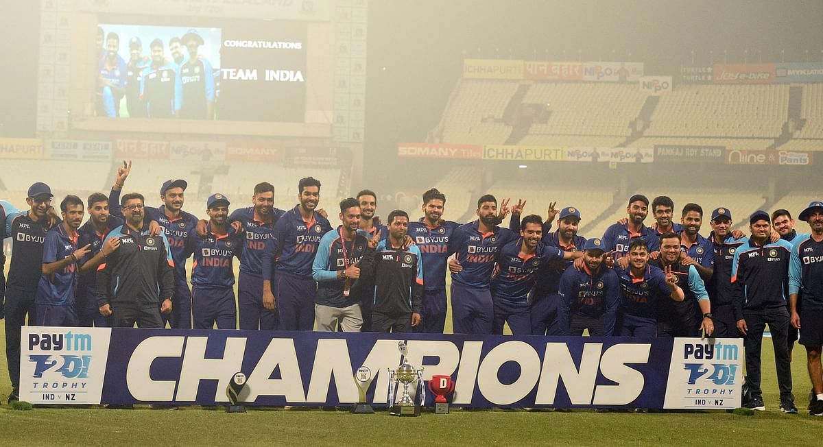 Indian players celebrate with the winners trophy after their win in the third Twenty20 cricket match against New Zealand in Kolkata. Credit: IANS Photo