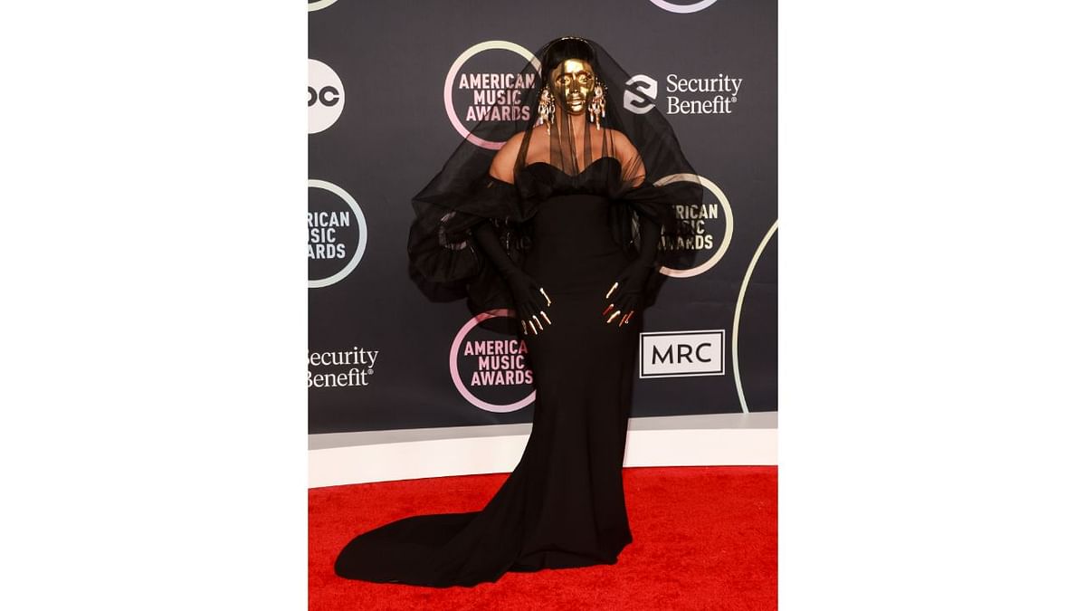 Dressed in all black, Cardi B opted for maximum safety and wore a golden mask that covered her entire face. Credit: AFP Photo