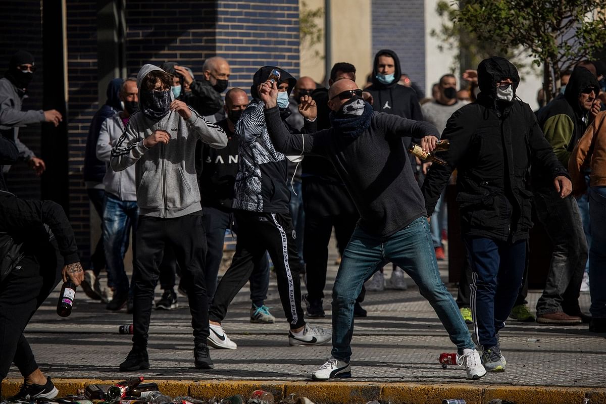 Protesters clash with police forces during a strike organized by metal workers in Cadiz, southern Spain. Credit: AP Photo