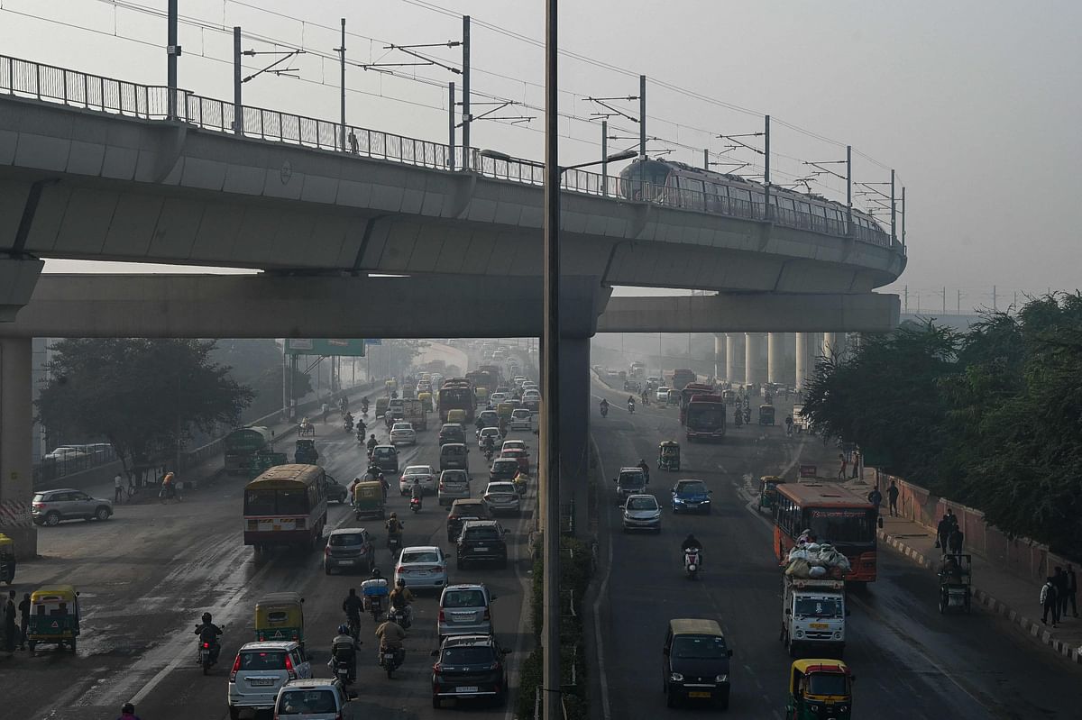 People commute along a street amid smoggy conditions in New Delhi. - New Delhi, the sprawling megacity of 20 million people is regularly ranked the world's most polluted capital. Credit: AFP Photo