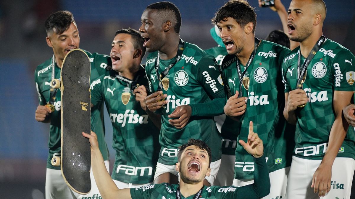Palmeiras' Gustavo Scarpa celebrates winning the Copa Libertadores with teammates. Credit: Reuters Photo