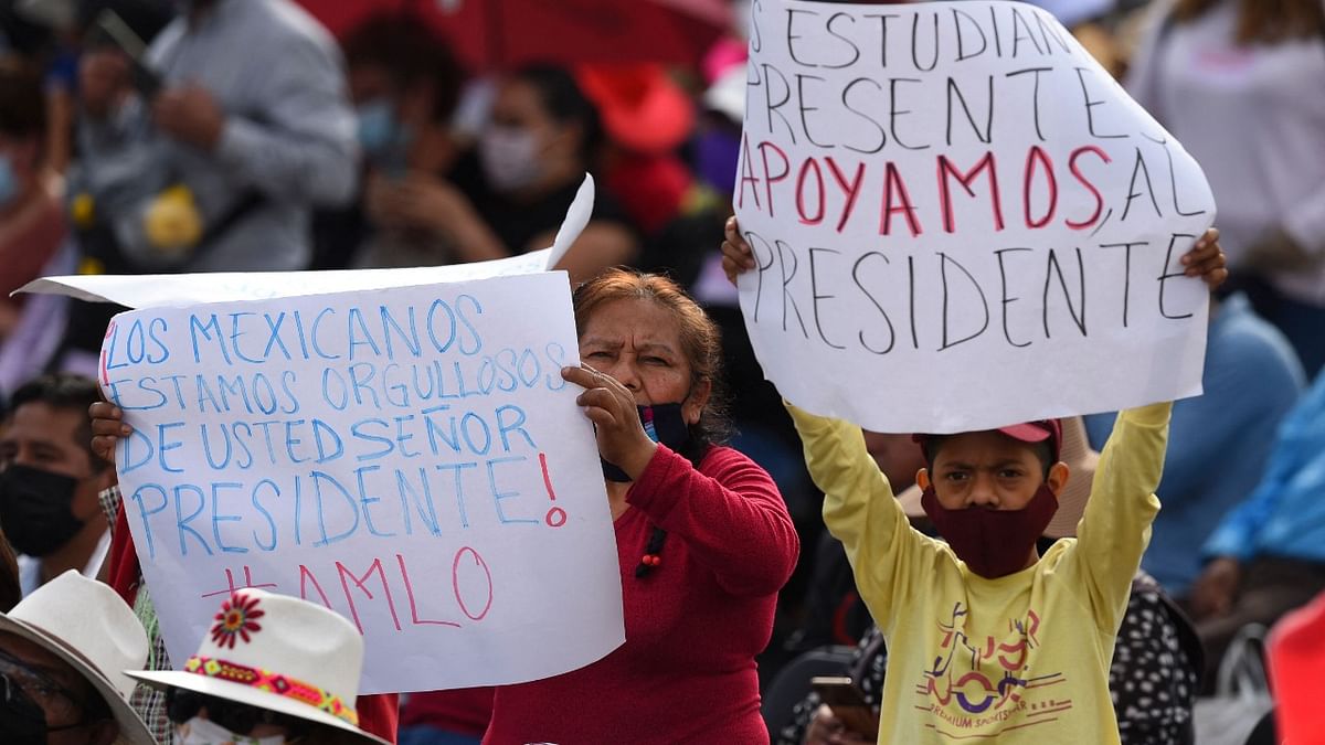 People gather at the Zocalo square waiting for the arrival of Mexican President Andres Manuel Lopez Obrador who will present a Message to the Nation for his three years in power in Mexico City. Credit: AFP Photo
