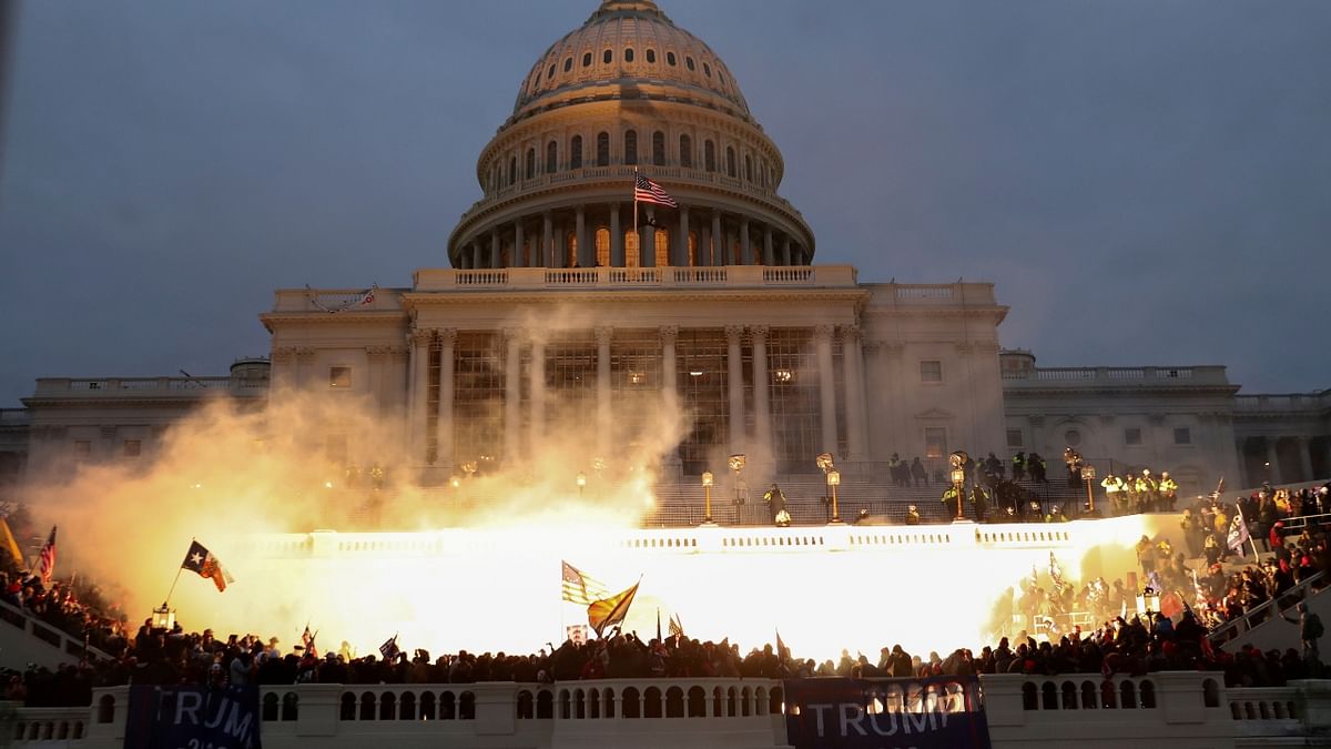 An explosion caused by a police munition is seen while supporters of US President Donald Trump rally to contest the certification of the 2020 US presidential election, at the US Capitol Building in Washington. Credit: Reuters Photo