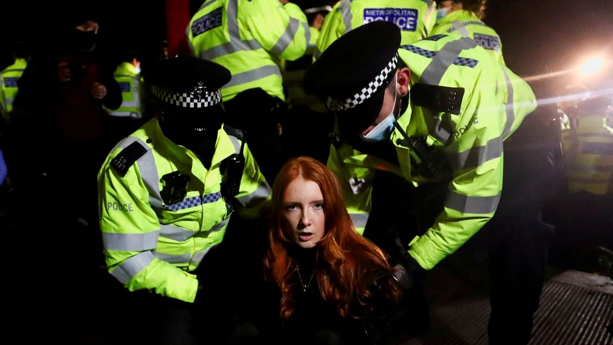 “This photograph was taken following a vigil for Sarah Everard, a young woman whose kidnap and murder by a serving police officer in London a few days earlier unleashed a wave of revulsion in the United Kingdom. It shows a lone female protester, student Patsy Stevenson, being carted off by male police officers. It became an image that captured the national mood of anger at the insecurity women face in the United Kingdom and around the world.” Credit: Reuters Photo