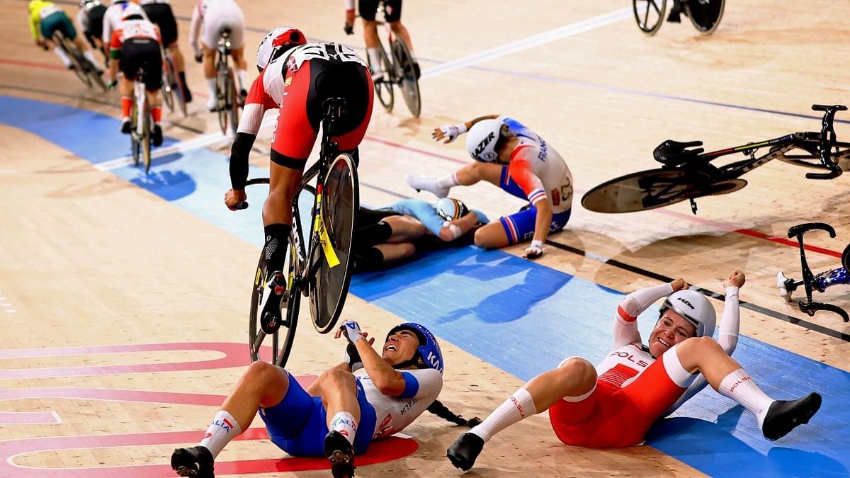 Participants react after their cycles crash in between the race. Credit: Reuters Photo