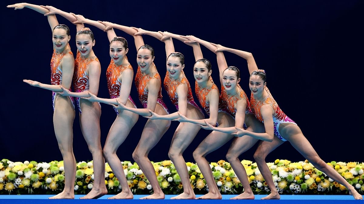 Synchronised swimming team from China strike a perfect pose that shows poise. Credit: Reuters Photo