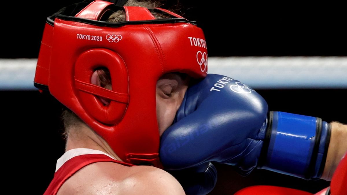 Nouchka Fontijn of the Netherlands recieves a perfect punch from Lauren Price of Britain. Credit: Reuters Photo