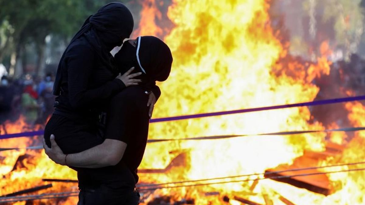 Demonstrators embrace during a protest against Chile's government on the second anniversary of the protests and riots that rocked the capital in Santiago, Chile. Credit: Reuters Photo