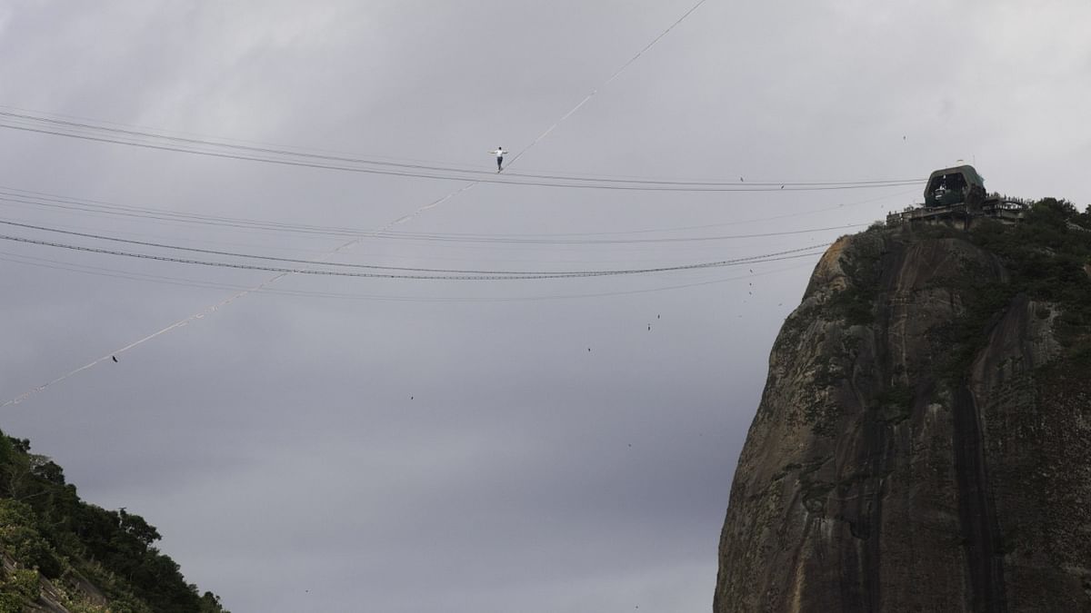 French acrobat Nathan Paulin walks on a slackline between Babilonia Hill and Urca Hill, in Rio de Janeiro. Credit: Reuters Photo