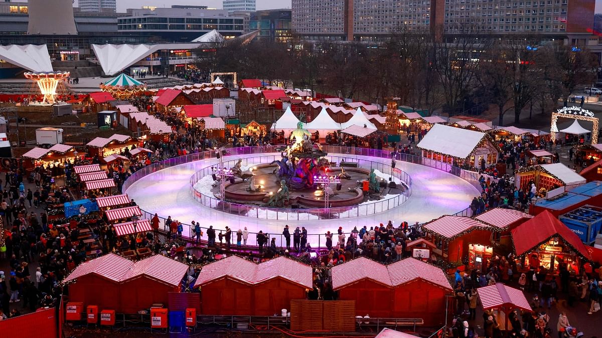 A general view shows visitors to the Berlin town hall (Rote Rathaus) Christmas market near Alexanderplatz in Berlin. Credit: Reuters Photo