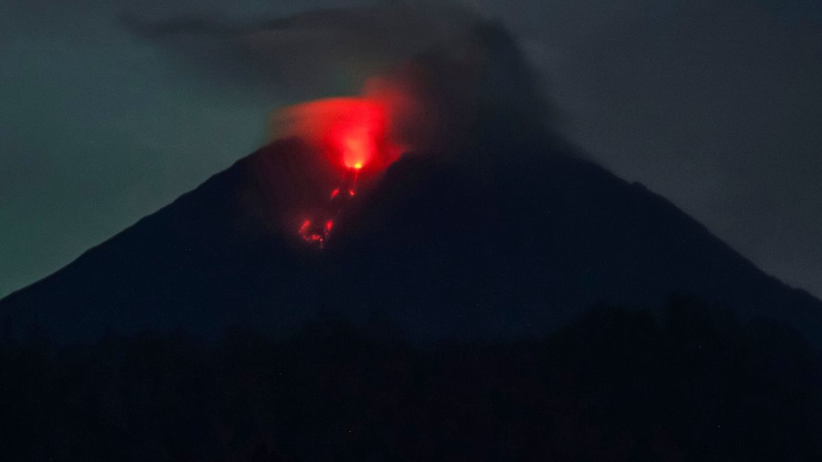 The biggest mountain on the island of Java thundered to life, mushrooming volcanic ash high into the sky and raining hot mud as thousands of panicked people fled their homes. At least 15 were killed and over dozens injured. Credit: AFP Photo