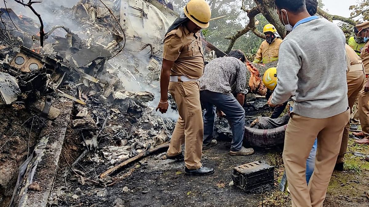 Rescue officals at the spot where an IAF Mi-17V5 helicopter crashed in Coonoor, Tamil Nadu. Credit: PTI Photo