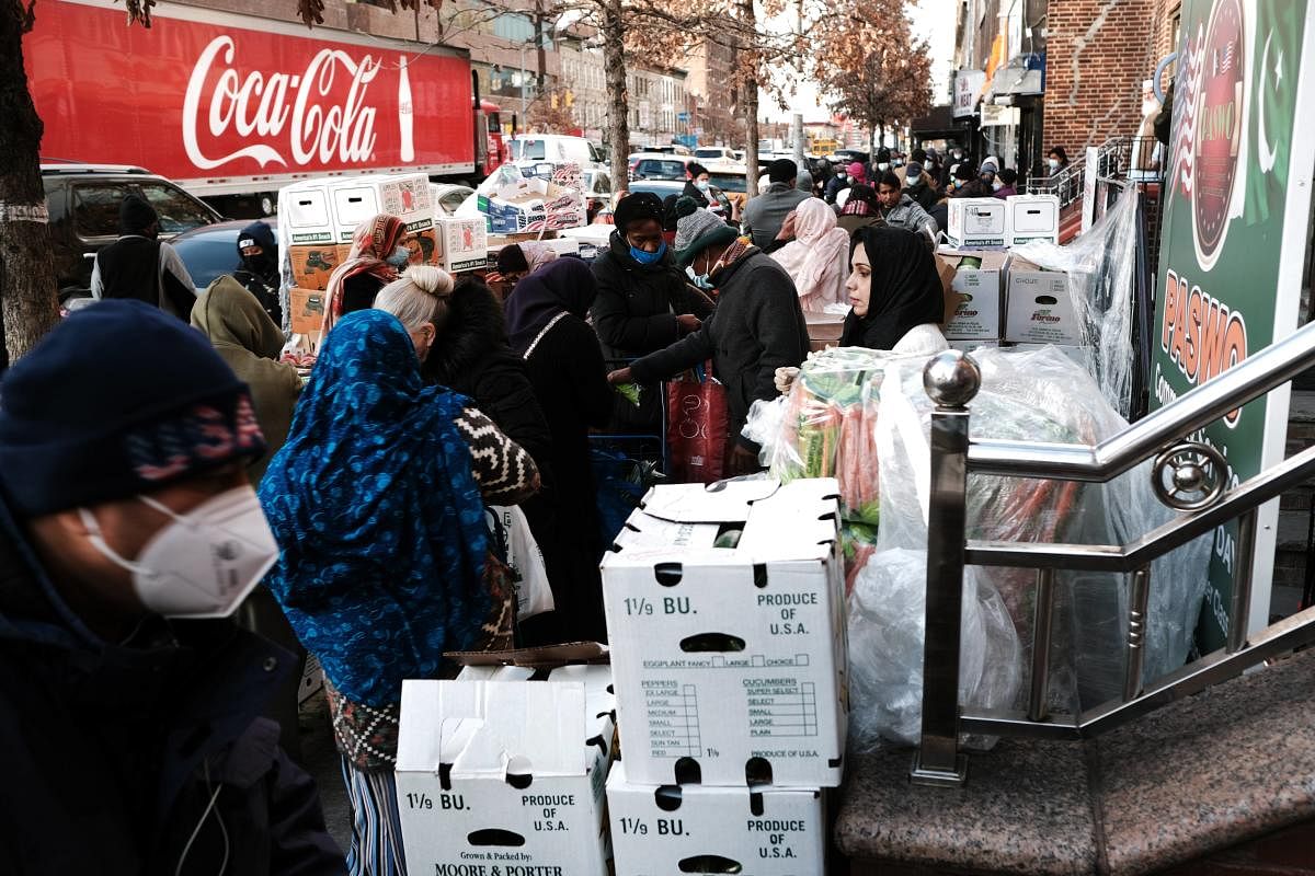 Free food is handed out by the Brooklyn community organization PASWO during a weekly food distribution. Over 10% of U.S. households (13.8 million) were described as food insecure in 2020. Inflation, job insecurity due to COVID-19 and other chronic problems have contributed to the issue of food insecurity in America. Credit: AFP Photo