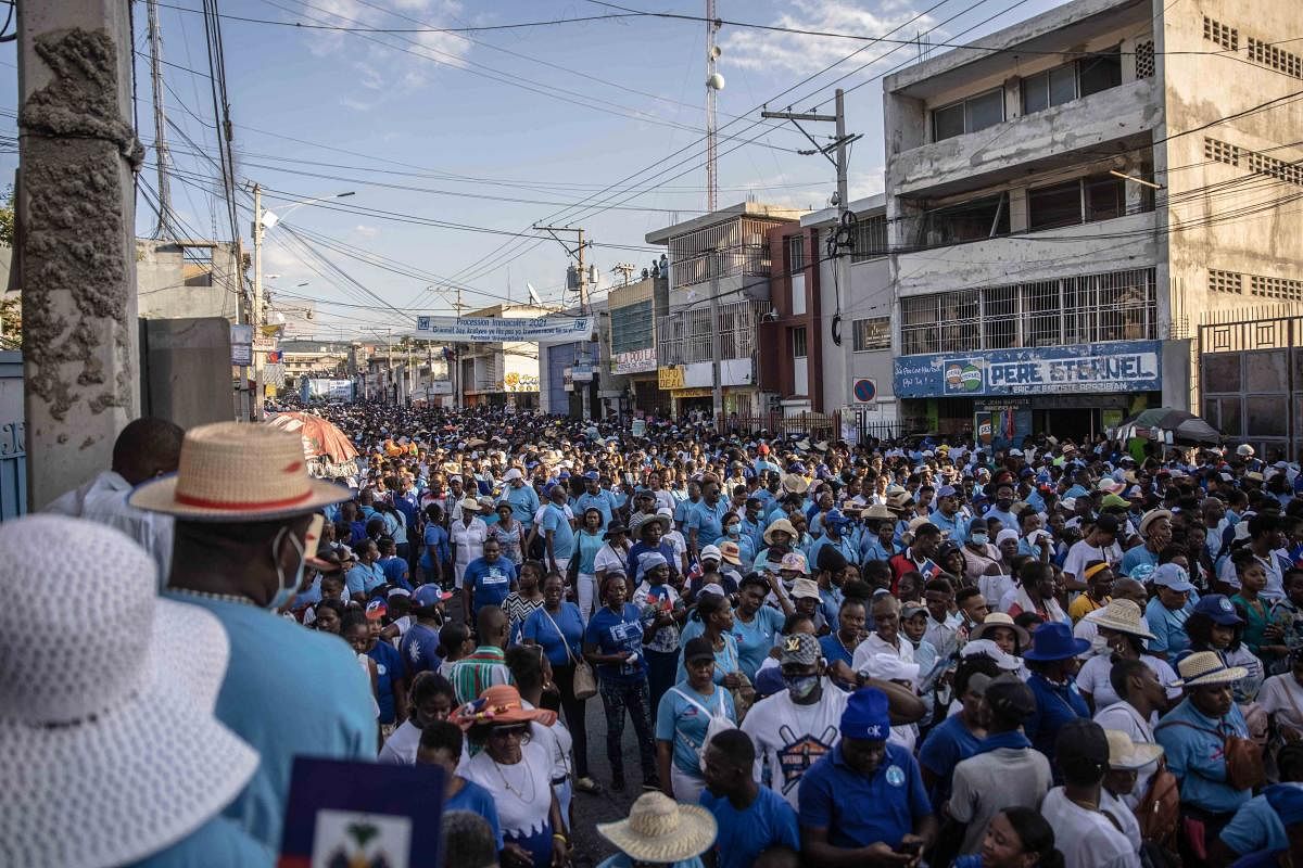 Worshipers attend the march for the Feast of the Immaculate Conception in Port-au-Prince, Haiti, where thousands of people took to the streets to pray for Haiti and say no to insecurity. Credit: AFP Photo