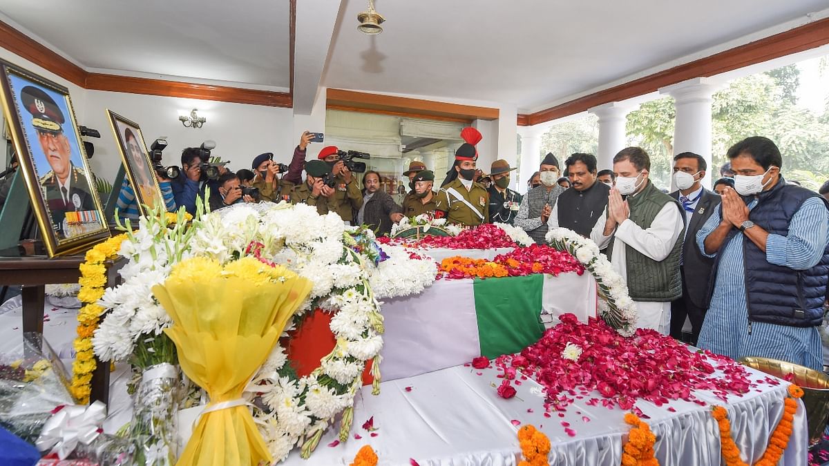 Congress leaders Rahul Gandhi and KC Venugopal pay tribute to CDS Gen Bipin Rawat and his wife Madhulika Rawat at his residence in New Delhi. Credit: PTI Photo