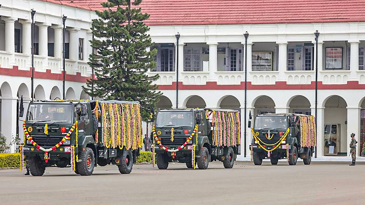 The mortal remains of the crash victims were brought to the venue earlier in decorated army trucks. Credit: PTI Photo