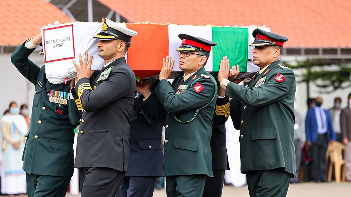 The mortal remains of the crash victims in caskets wrapped in the Indian tricolour. Credit: PTI Photo