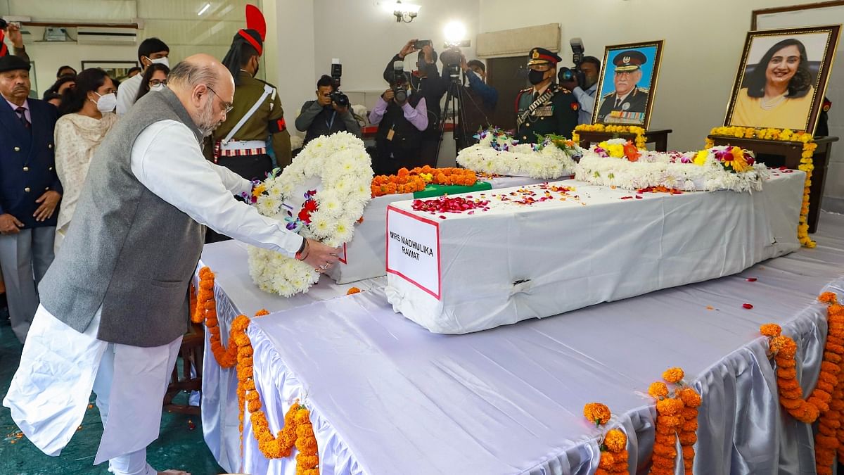 Union Home Minister Shri Amit Shah pays his last respects to late Gen Bipin Rawat and his wife Madhulika Rawat, in New Delhi. Credit: PTI Photo