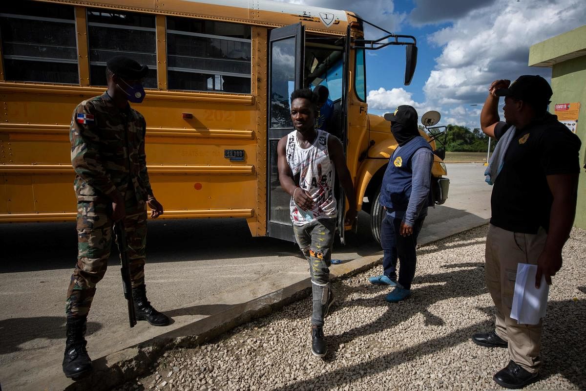 Haitians who were detained in Santo Domingo by agents of the General Directorate of Migration arrive to the Comendador border crossing in Elías Piña, Dominican Republic. So far this year, 31,712 Haitians have been deported by the Dominican Republic, 34% more than in 2020 (23,664). Almost 100% of undocumented foreigners in the country are Haitian. Credit: AFP Photo