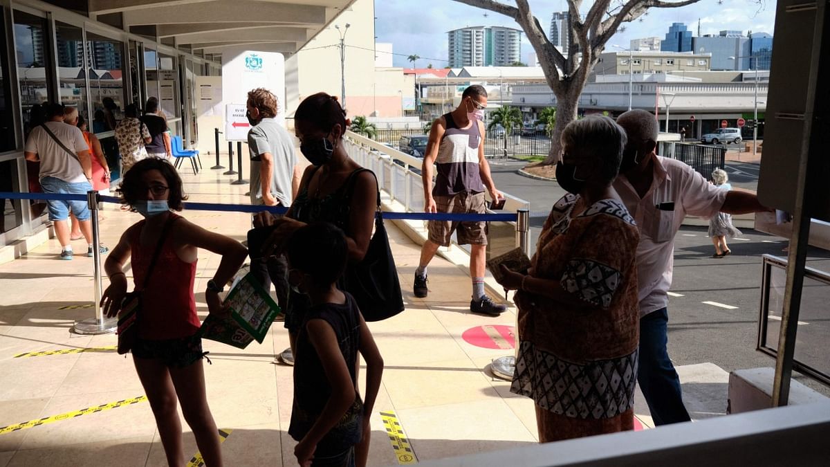 Residents wait to vote for the referendum on independence outside a polling station of the City Hall in Noumea, on the French South Pacific territory of New Caledonia. Credit: AFP Photo