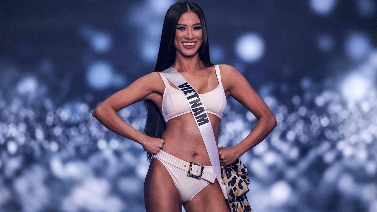 Miss Vietnam, Nguyen Huynh Kim Duyen, is all smiles as she walks the ramp during the swimsuit competition round. Credit: AFP Photo