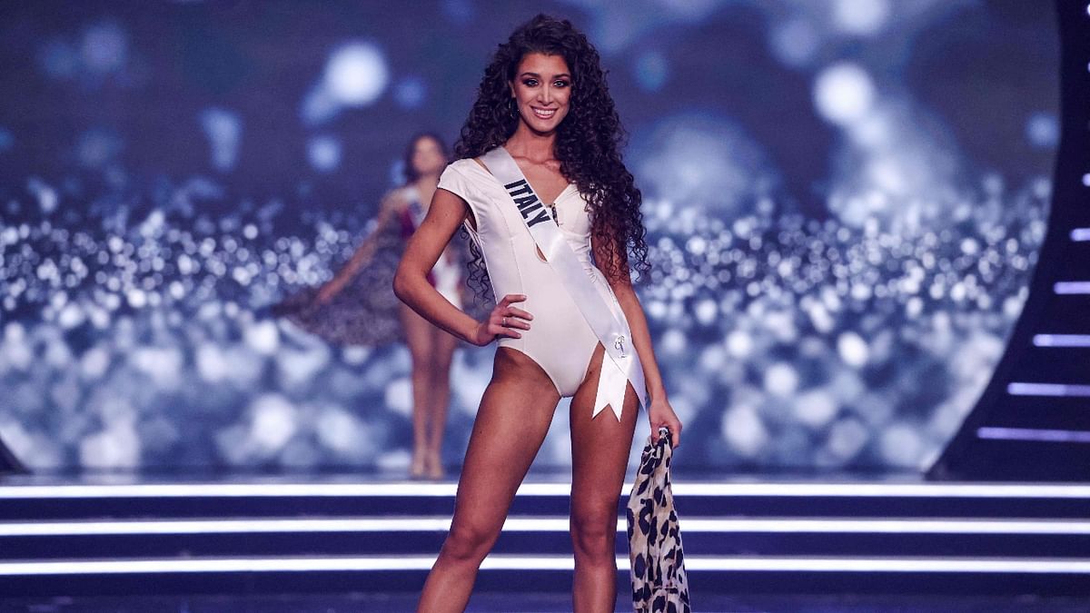 Miss Italy, Caterina Di Fuccia, sizzles in a white swimsuit during the swimsuit competition. Credit: AFP Photo