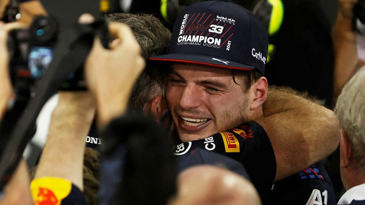 Red Bull's Max Verstappen celebrates winning the race and the world championship. Credit: Reuters Photo