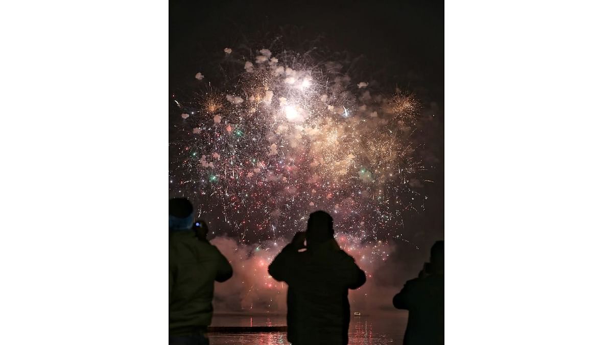 Fireworks light up the sky during the 'Ganga Aarti' at Ganga Ghat in Varanasi. Credit: PTI Photo