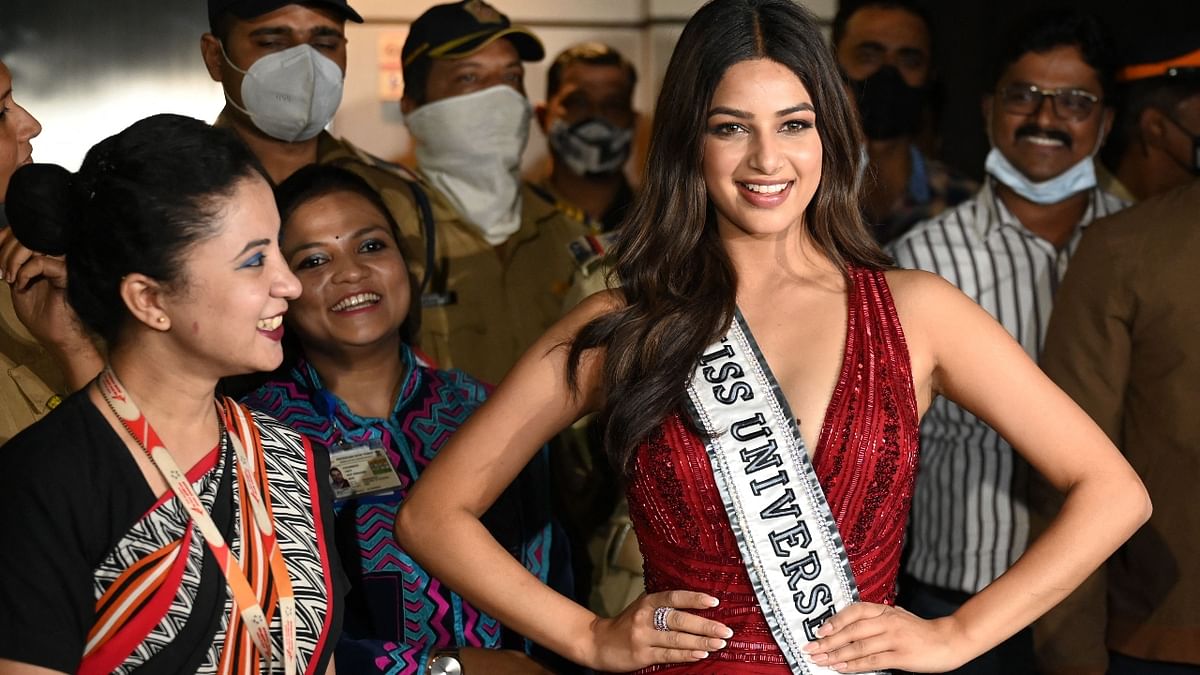 Miss Universe Harnaaz Sandhu poses for the cameras upon her arrival at the airport in Mumbai. Credit: AFP Photo