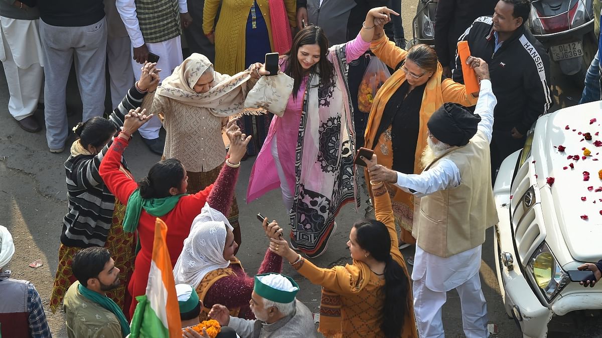 The 'ghar wapsi' was marked with celebratory atmosphere at Ghazipur border, where protestors and supporters of the Tikait family-led Bharatiya Kisan Union (BKU) danced to patriotic and regional tunes hailing the farming community. Credit: PTI Photo