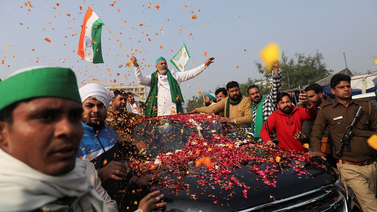 After an iconic year-long struggle that resulted in the withdrawal of contentious farm laws, farmer leader Rakesh Tikait and his supporters on Wednesday left for their homes from Ghazipur on the Delhi-Uttar Pradesh border that had become their residence for 383 days. Credit: Reuters Photo