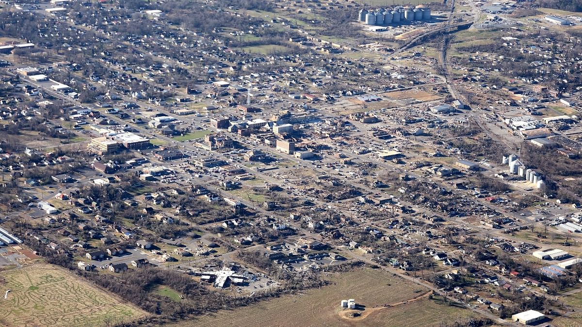 Storm trackers said it had lofted debris 30,000 feet (9,100 meters) into the air, and the Mayfield twister appeared to have broken an almost century-old record, tracking on the ground more than 200 miles (320 kilometers). Credit: AFP Photo