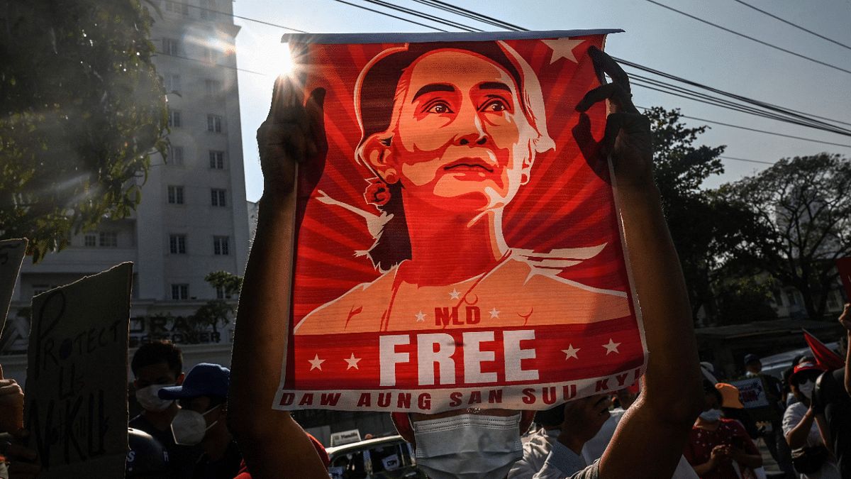 A protester holds up a poster featuring Aung San Suu Kyi during a demonstration against the military coup in front of the Central Bank of Myanmar in Yangon. Credit: AFP Photo
