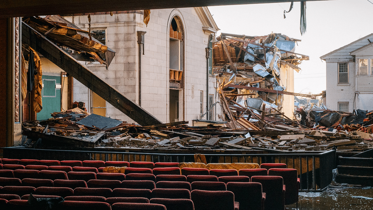 Debris is seen from the inside of the American Legion theatre on December 19, 2021 in Mayfield, Kentucky. Credit: AFP Photo