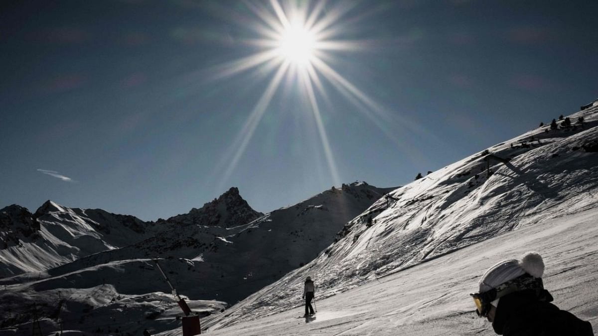 Skiers ride down a slope on December 20, 2021 at Courchevel ski resort in the French Alps. Credit: AFP Photo