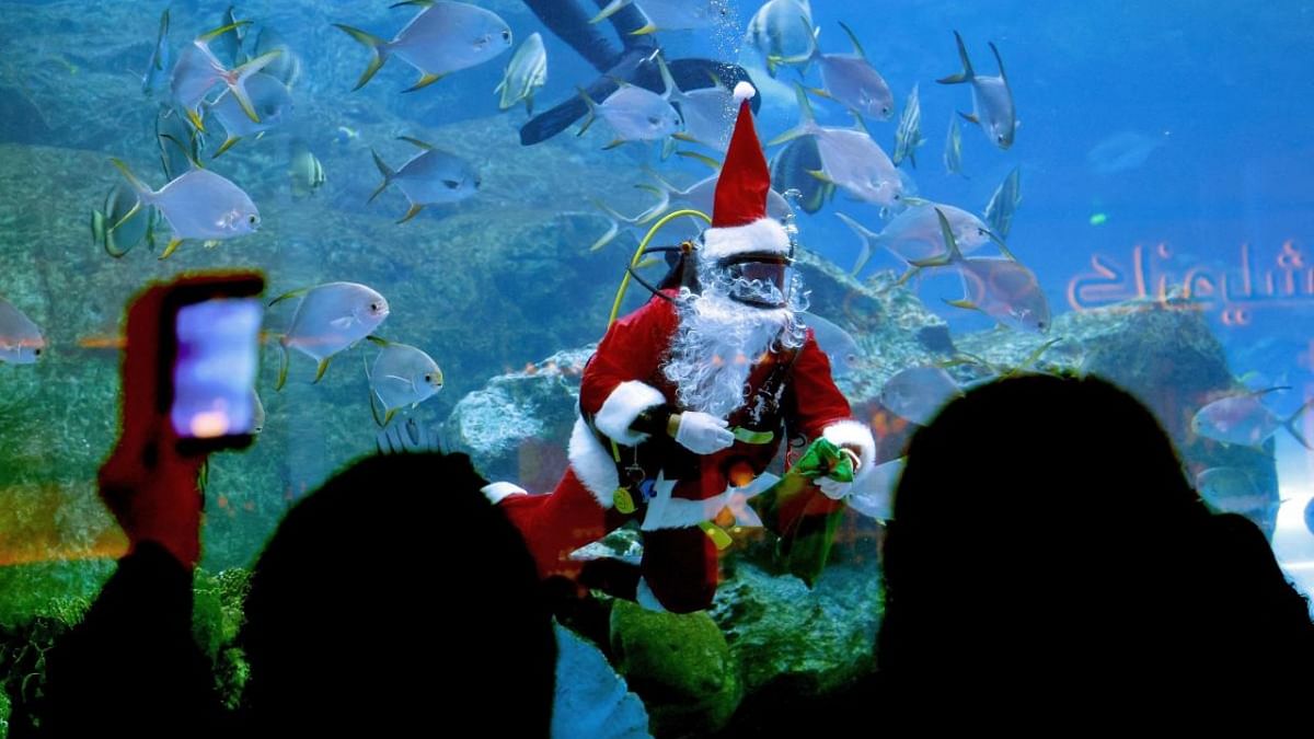 A diver dressed as Santa Claus greets visitors at the Dubai mall aquarium, in the United Arab Emirates. Credit: AFP Photo