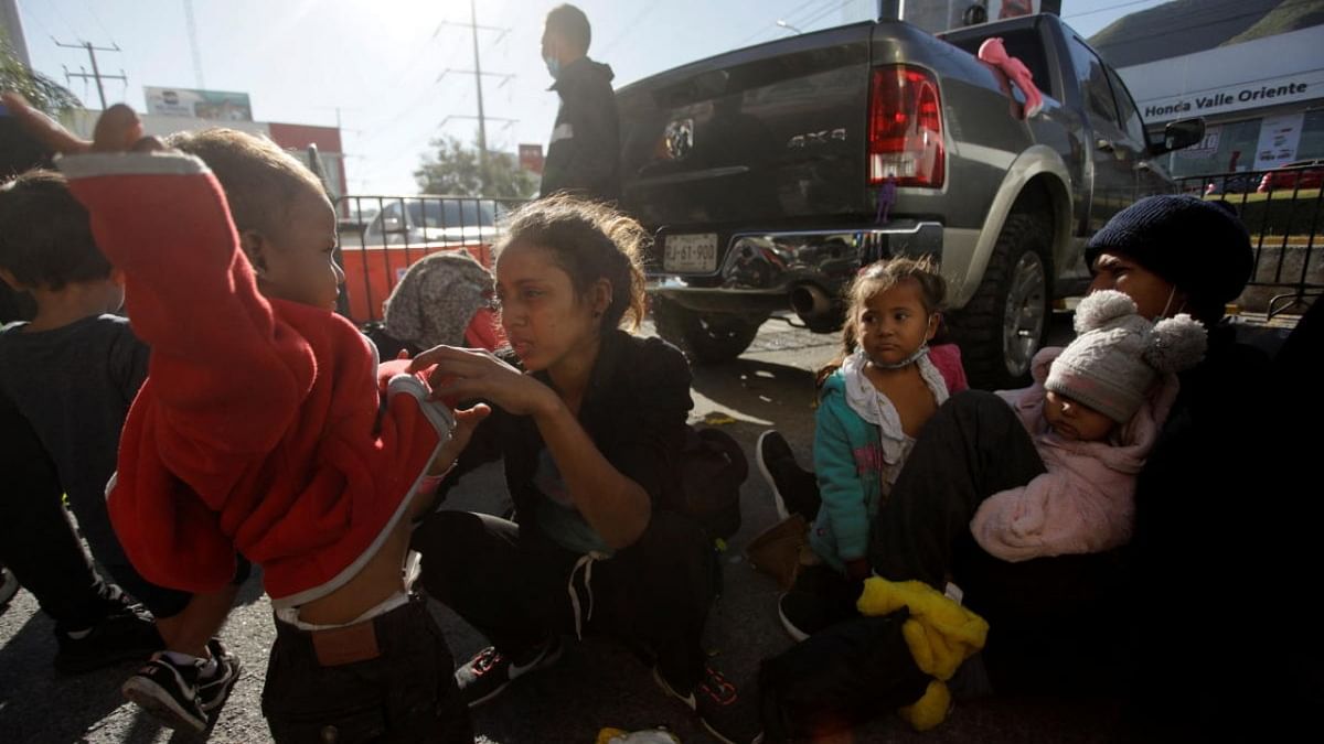 A migrant family is pictured after they arrived as part of a migrant caravan to northern Mexico, after receiving their humanitarian visas to transit through the country, in Monterrey. Credit: Reuters photo
