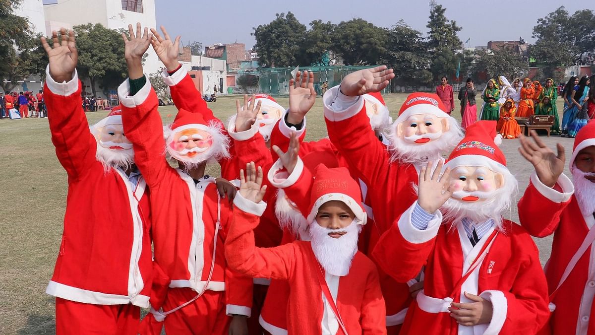 Children found ways to be in the holiday spirit by dressing up as Santa and indulging in various activities across India. Credit: PTI Photo