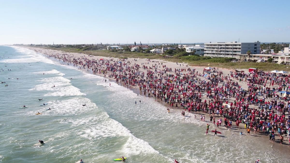 People wearing Santa Claus costumes attend an event in Cocoa Beach, Florida. Credit: Reuters photo/NPI/Florida's Space Coast Office of Tourism