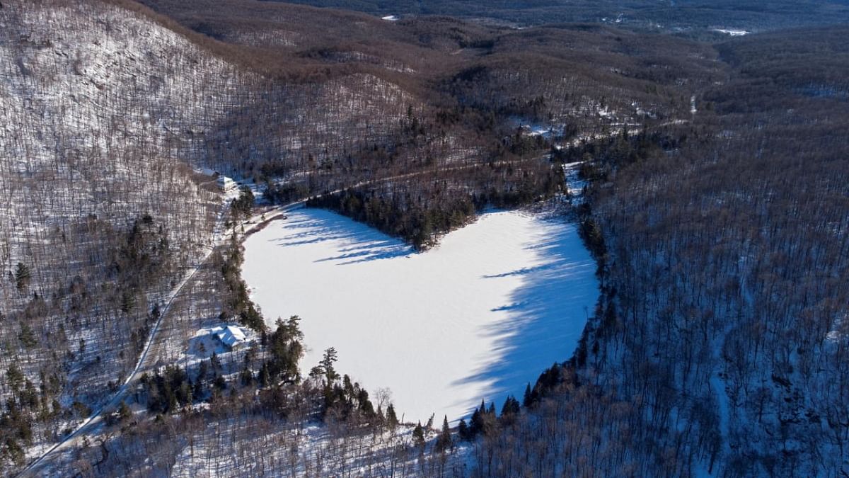 Snow covers the heart-shaped and frozen Baker Pond on Christmas Eve in East Bolton, Quebec, Canada. Credit: Reuters photo