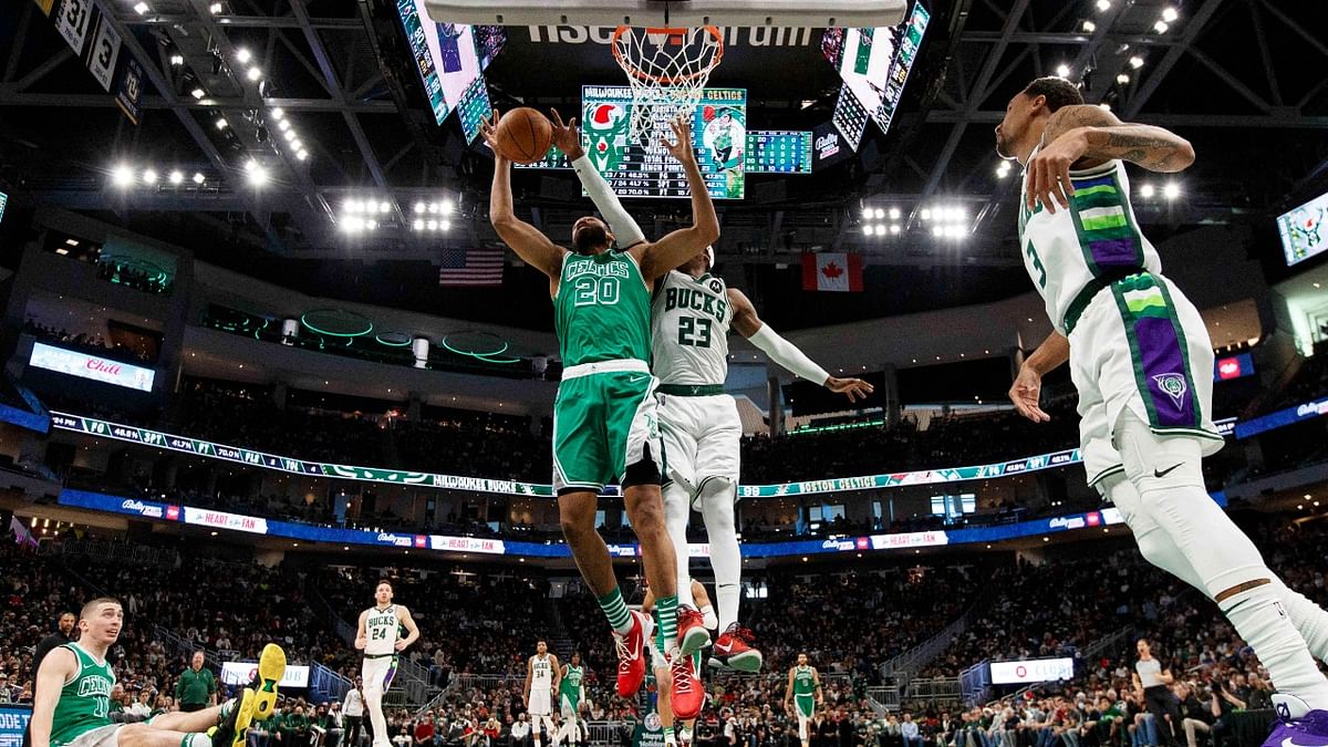 Boston Celtics forward Jabari Parker (20) reaches for a rebound during the fourth quarter against the Milwaukee Bucks at Fiserv Forum. Credit: USA Today Sports