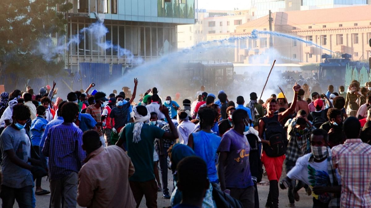 Sudanese security forces use water cannons and teargas against protesters in the capital Khartoum during a demonstration demanding civilian rule. Credit: AFP Photo