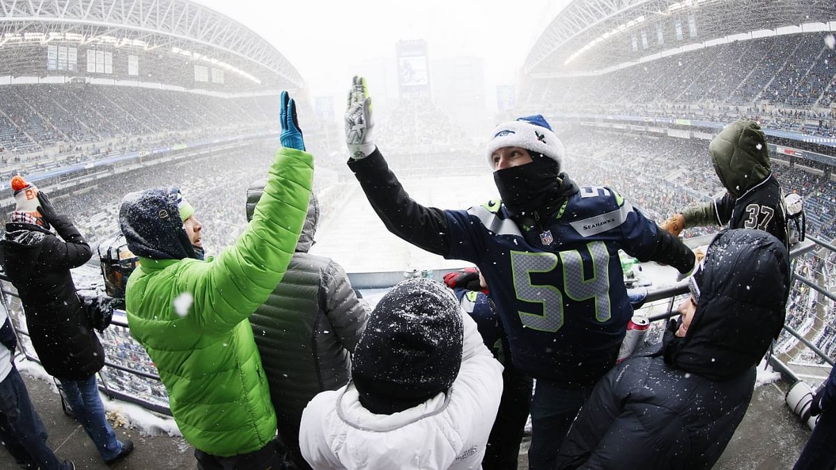 Seattle Seahawks fans cheer after a touchdown scored by DK Metcalf #14 (not pictured) during the first quarter against the Chicago Bears. Credit: AFP Photo