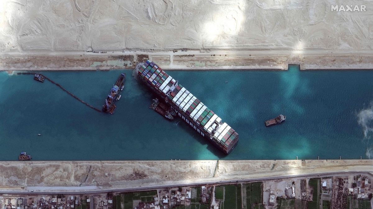 Suez Canal obstruction: The giant container ship Ever Given blocked the Suez Canal in March, bringing a halt to shipping for six days in one of the world's busiest waterways. The ship, almost as long as New York's Empire State Building, caused a record traffic jam of 422 ships loaded with 26 million tonnes of merchandise, worsening supply difficulties already disrupted by the Covid-19 pandemic. Credit: AFP Photo