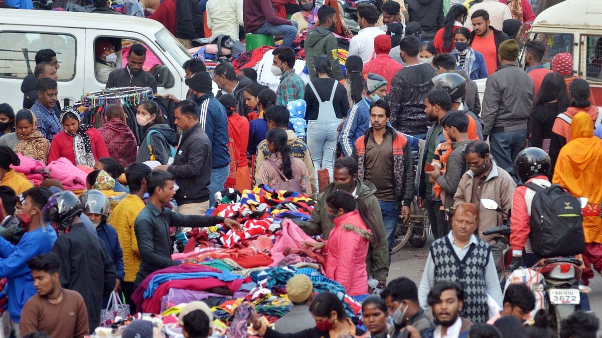 People visit a crowded market on Christmas eve amid concern over rising Omicron cases, in Ranchi. Credit: PTI Photo