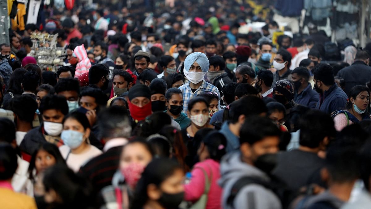 Large number of people are seen at market amid the rising cases of Omicron, in New Delhi. Credit: Reuters Photo
