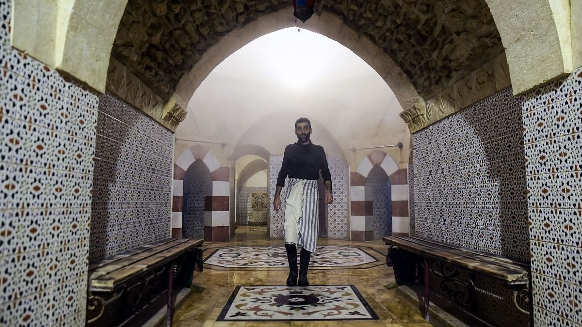 A man walks at Hammam al-Qawas, a traditional Turkish bathhouse, in Syria's northern city of Aleppo. Credit: AFP Photo