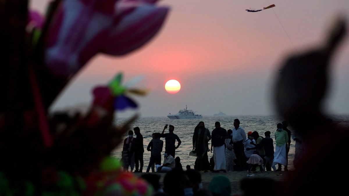 Locals at the seashore during sunset at Beypore in Kozhikode. Credit: PTI Photo
