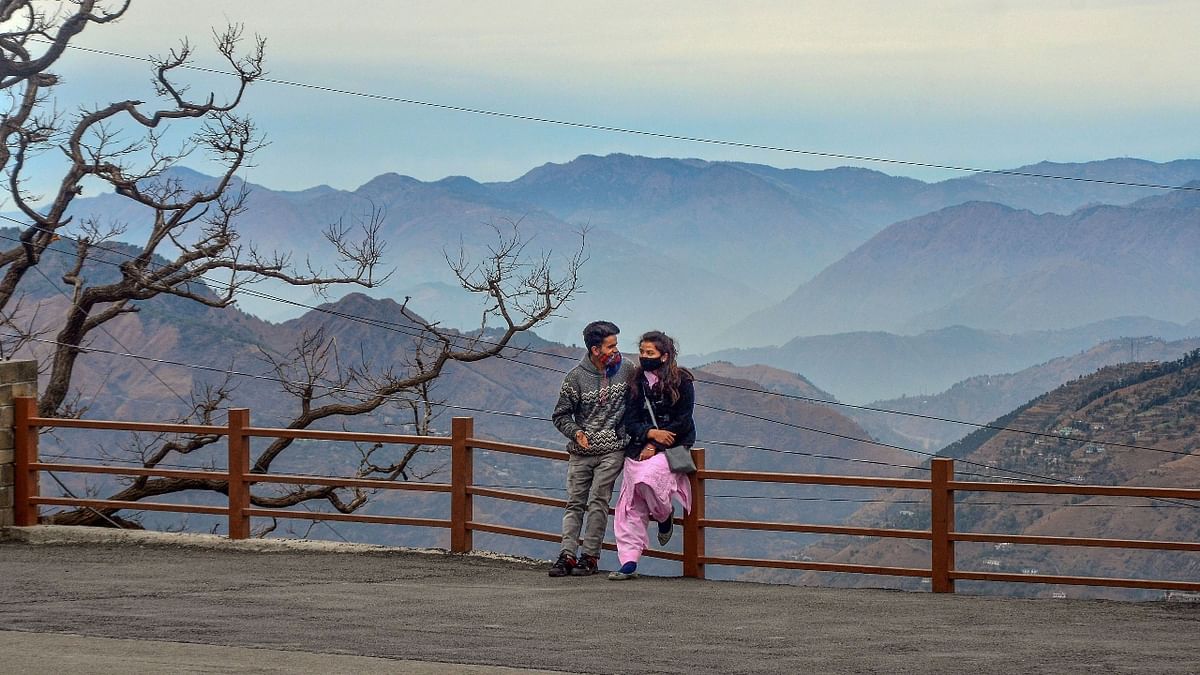 Tourists enjoying the weather at Ridge on a cold winter day in Shimla. Credit: PTI Photo
