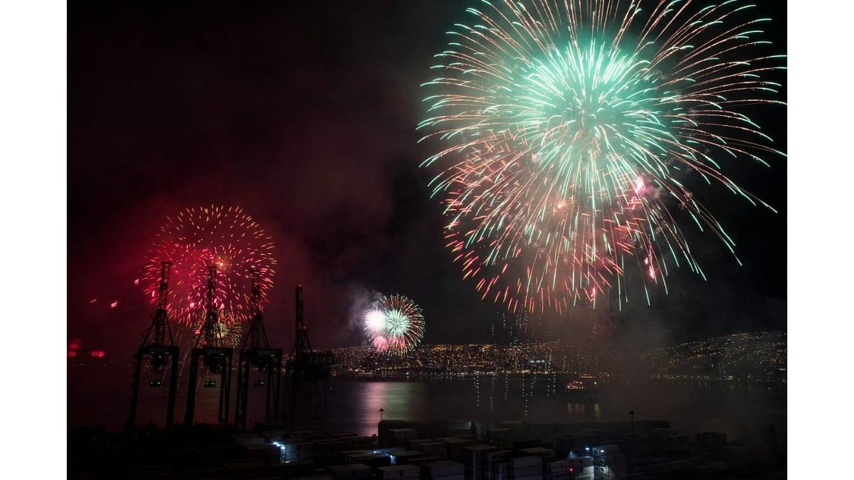 Fireworks are seen in the port of Valparaiso's on the coast of Chile during New Year celebrations on January 1, 2022. Credit: AFP Photo